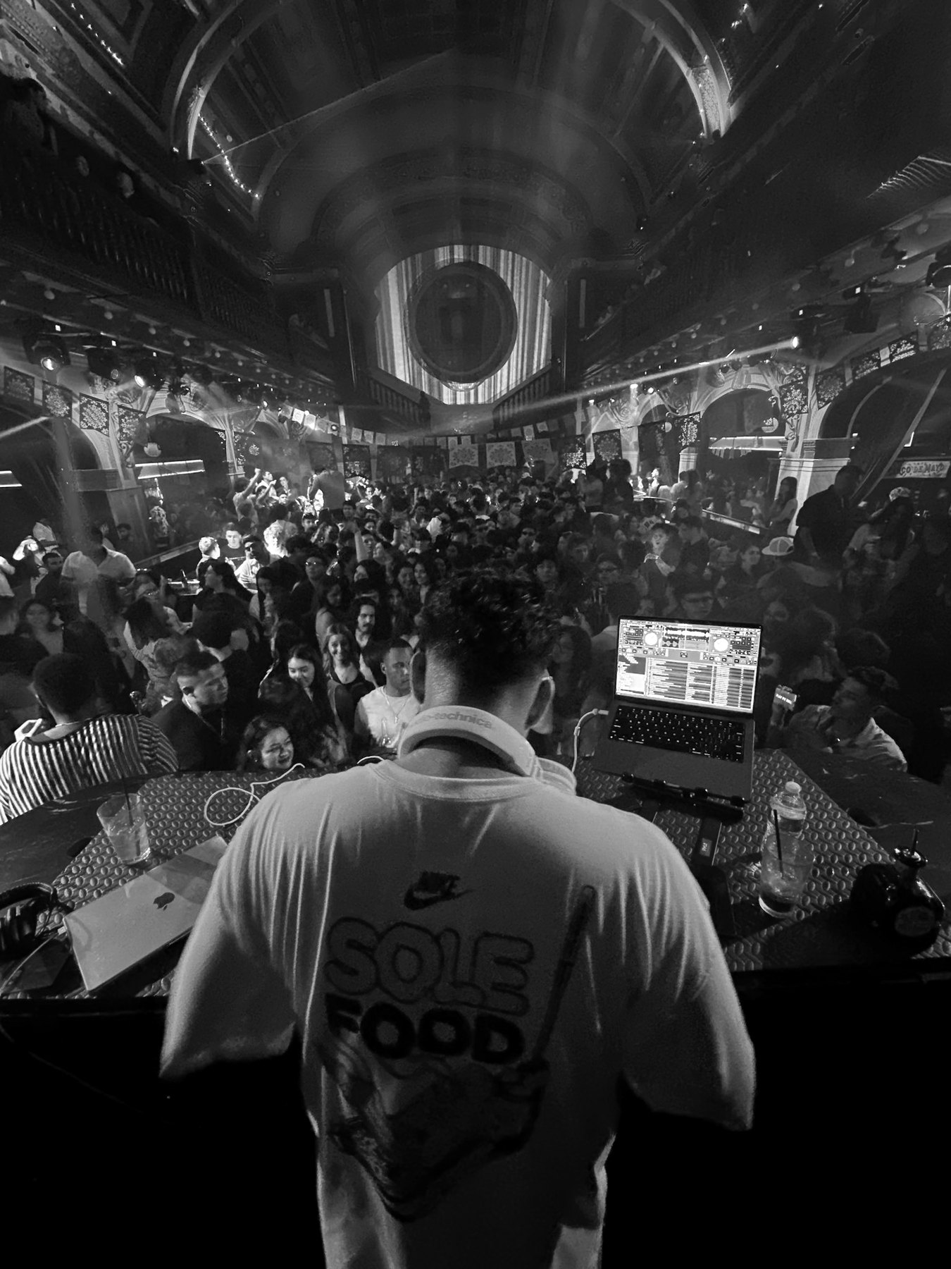Nightclub crowd from behind the DJ booth in Chicago